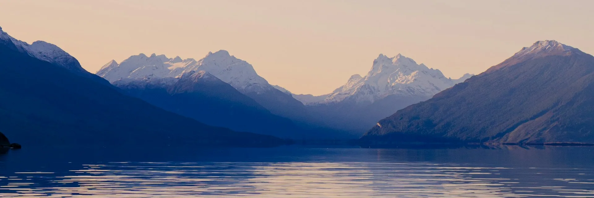 A mountain reflected on the surface of a still lake